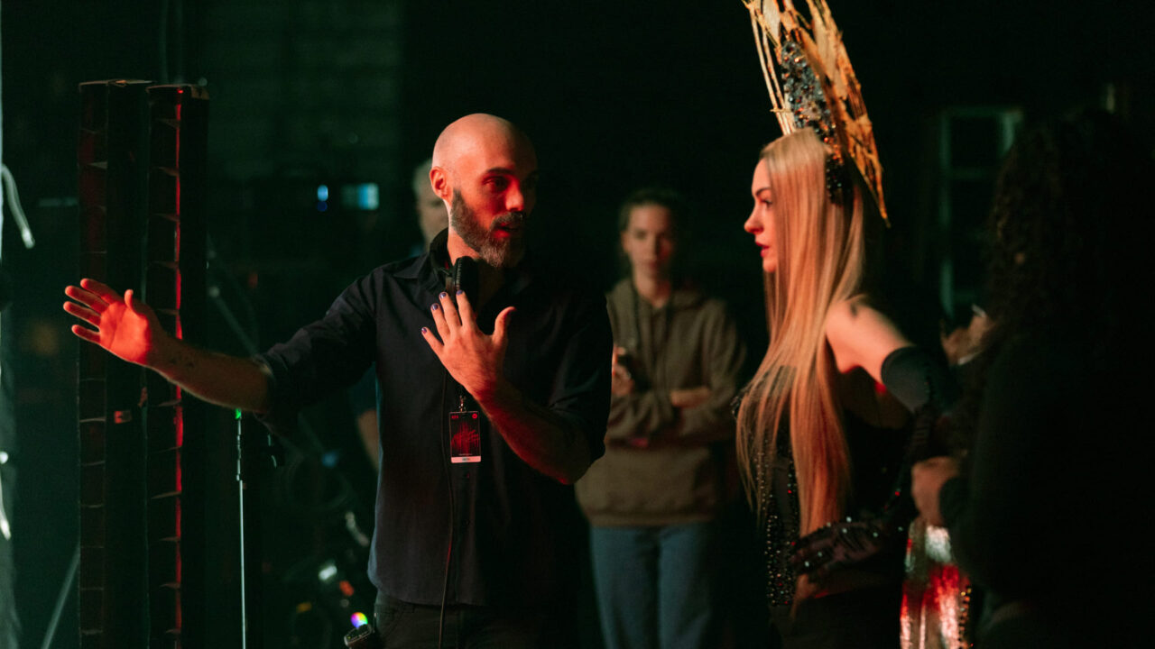 (L-R) David Lowery, Anne Hathaway Credit: Photo by Frederic Batier. Courtesy of A24.